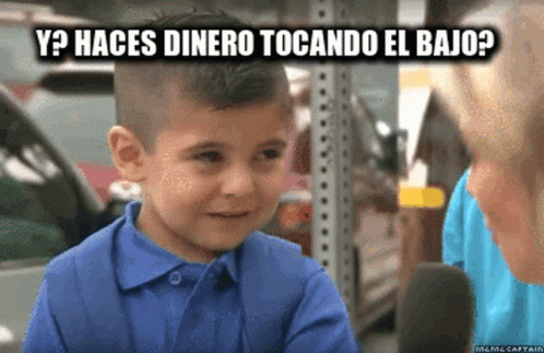 A Young Boy In A Blue Shirt Is Talking To A Woman And The Words Y Haces Dinero Tocando El Bajo Appear Above Him GIF