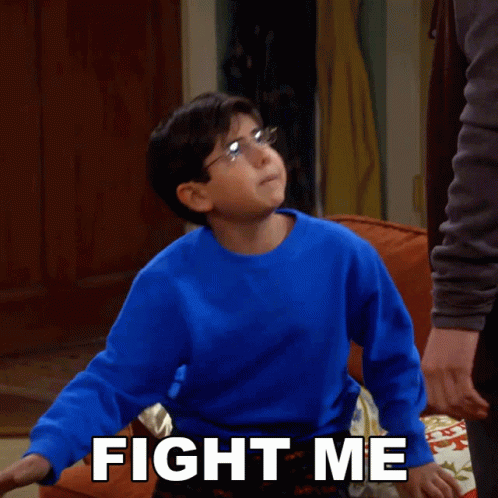 A Young Boy In A Blue Sweater Says " Fight Me " GIF