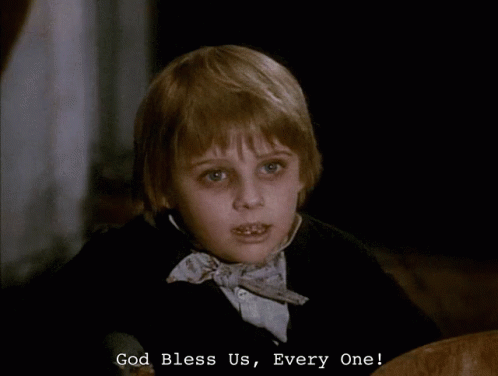 a young boy in a bow tie says " god bless us "