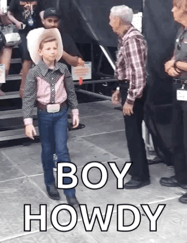 A Young Boy In A Cowboy Outfit Is Standing Next To A Man In A Plaid Shirt And Says Boy Howdy GIF