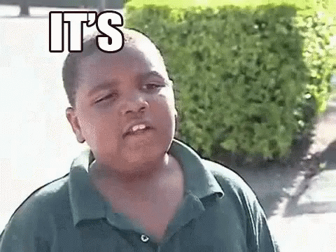 Boy In Green Shirt Making Funny Face With It's Text GIF