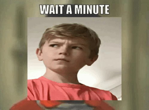 A Young Boy In A Red Shirt With The Words Wait A Minute Above Him GIF