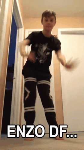 A Young Boy Is Dancing With The Words Enzo Df Written On The Bottom GIF