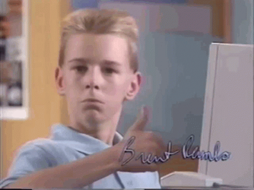 A Young Boy Is Giving A Thumbs Up In Front Of A Computer With The Name Brunt Lambo Written On It GIF