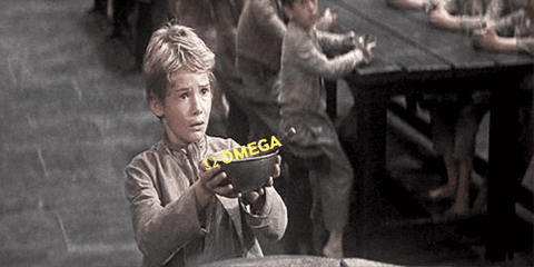 A Young Boy Is Holding A Bowl That Says Omega On It GIF