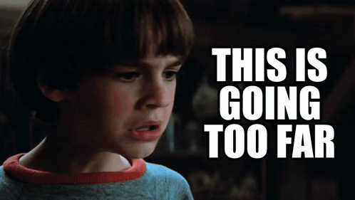 A Young Boy Is Looking At Something With The Words This Is Going Too Far Behind Him GIF