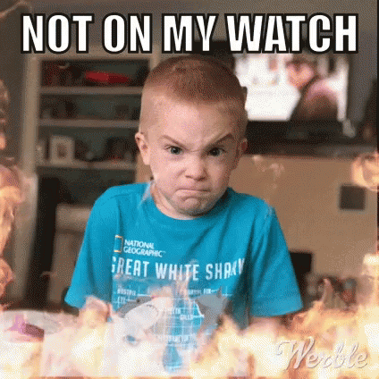 A Young Boy Is Making A Funny Face In Front Of A Fire . GIF