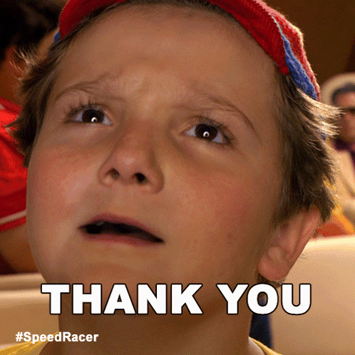A Young Boy Is Making A Thank You Sign GIF