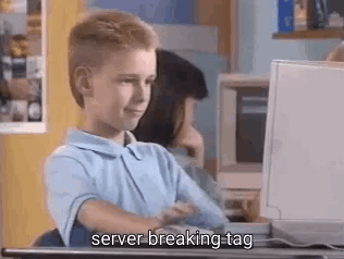 A Young Boy Is Sitting At A Desk In Front Of A Computer And Saying Server Breaking Tag . GIF
