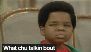 Boy Sitting On Bed Making Funny Face Saying What Chu Talkin Bout GIF