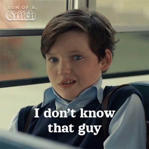 A Young Boy Is Sitting On A Bus And Says " I Don T Know That Guy " GIF