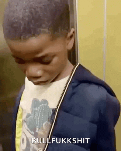 A Young Boy Is Standing In An Elevator With His Eyes Closed And The Words Bullfukkshit Above Him . GIF