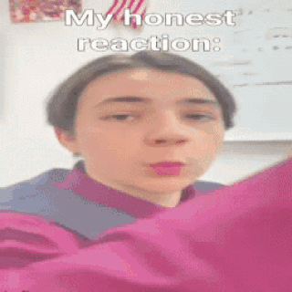 A Young Boy Is Wearing A Pink Shirt And Making A Funny Face With The Caption My Honest Reaction GIF