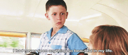 A Young Boy Talking To A Woman With The Words " I Had Never Seen Anything So Beautiful In My Life " Below Him GIF
