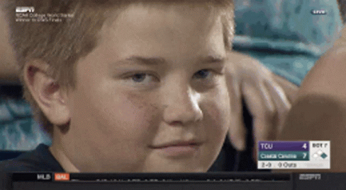 A Young Boy Watches A Game Between Tcu And Boston On Espn GIF