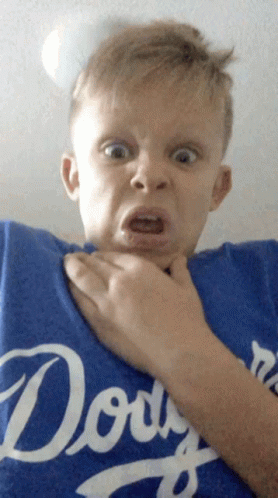 A Young Boy Wearing A Blue Dodgers Shirt Makes A Funny Face GIF