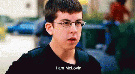 A Young Boy Wearing Glasses And A Black Shirt Says I Am Mclovin GIF