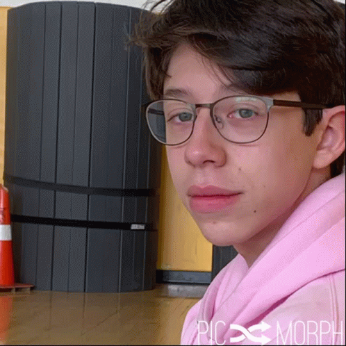 A Young Boy Wearing Glasses And A Pink Hoodie Has The Word Morph On The Bottom GIF
