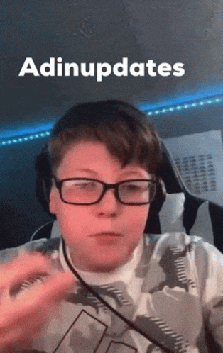 A Young Boy Wearing Glasses And Headphones With The Word Adiupdates Above Him GIF