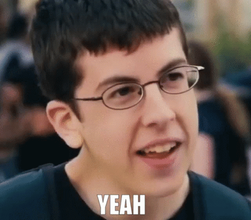 A Young Boy Wearing Glasses Is Making A Funny Face With The Words Yeah Written Below Him GIF