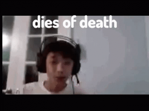 A Young Boy Wearing Headphones And A Hat With The Words `` Dies Of Death '' Behind Him . GIF
