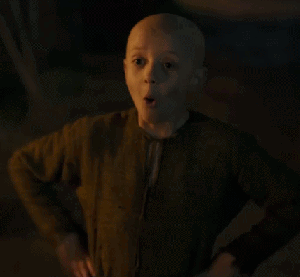 A Young Boy With A Bald Head Is Giving A Thumbs Up . GIF