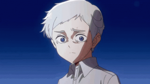 A Young Boy With White Hair And Blue Eyes Looks At The Camera GIF