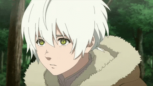 A Young Boy With White Hair And Green Eyes Looks At The Camera GIF