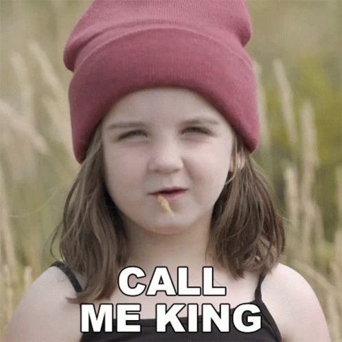A Young Girl Wearing A Beanie And A Black Tank Top Says Call Me King GIF