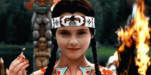 A Young Girl Wearing A Headband With A Skull On It GIF
