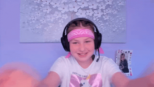 A Young Girl Wearing Headphones And A Bandana That Says ' Eternal Sunshine ' On It GIF
