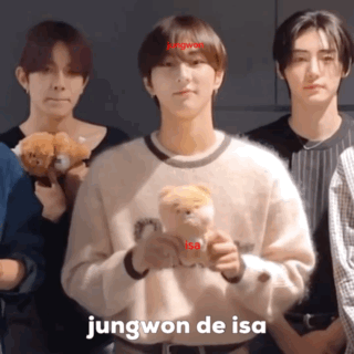 A Young Man Holding A Teddy Bear With The Name Jungwon De Isa Above Him GIF