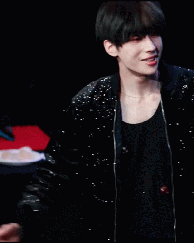 A Young Man In A Black Jacket Is Making A Heart Shape With His Hands On His Head . GIF