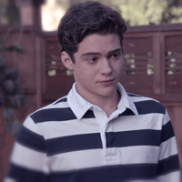 A Young Man In A Blue And White Striped Shirt GIF