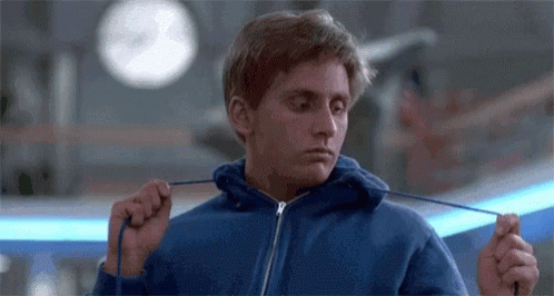 Young Man Tying Hoodie In Blue GIF