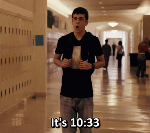 A Young Man In A Hallway With The Words It 'S 10:33 On The Bottom GIF