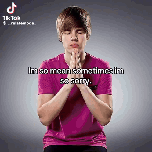 A Young Man In A Pink Shirt Is Praying With The Words Im So Mean Sometimes Im So Sorry Above Him GIF