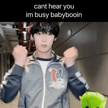 A Young Man In A Plaid Jacket With The Words Cant Hear You Im Busy Babyboin On The Bottom GIF