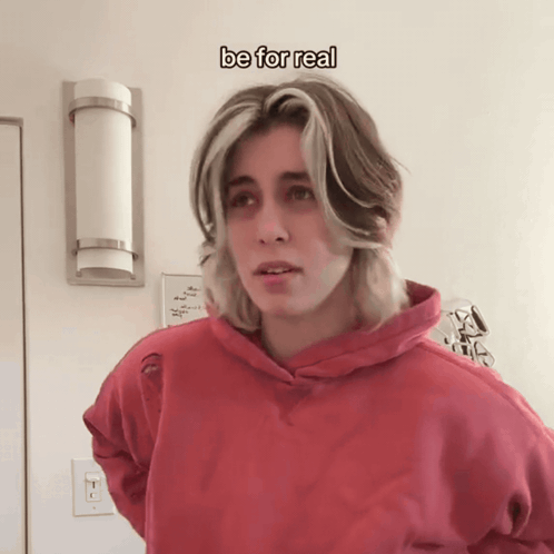 Young Man In Red Hoodie Standing Under Be For Real Text GIF