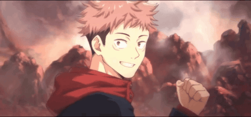 A Young Man In A Red Scarf Is Standing In Front Of A Mountain And Smiling . GIF