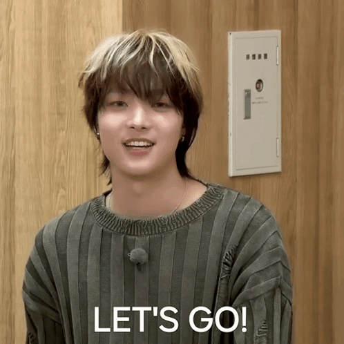 A Young Man In A Striped Sweater Says " Let 'S Go " GIF