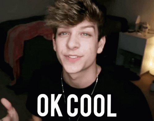 A Young Man Is Giving A Thumbs Up With The Words Ok Cool Behind Him GIF