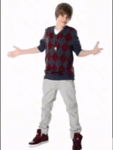 A Young Man Is Holding A Basketball In His Right Hand GIF