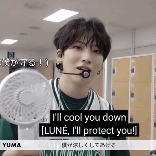 A Young Man Is Holding A Fan And Says " I 'Ll Cool You Down Luna I 'Ll Protect You " GIF