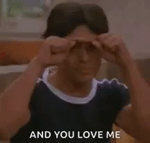 A Young Man Is Making A Fist Gesture And Says `` And You Love Me '' . GIF