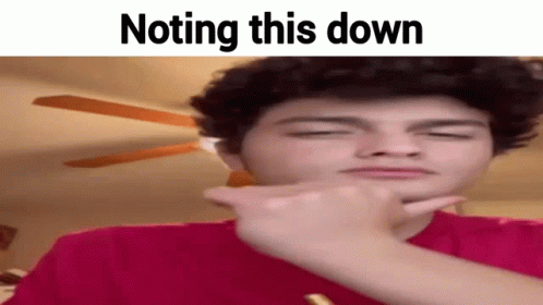 A Young Man Is Making A Funny Face And Pointing At Something . GIF