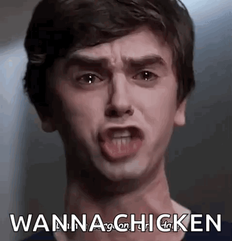 A Young Man Is Making A Funny Face And Saying `` Wanna Chicken '' With His Mouth Open . GIF
