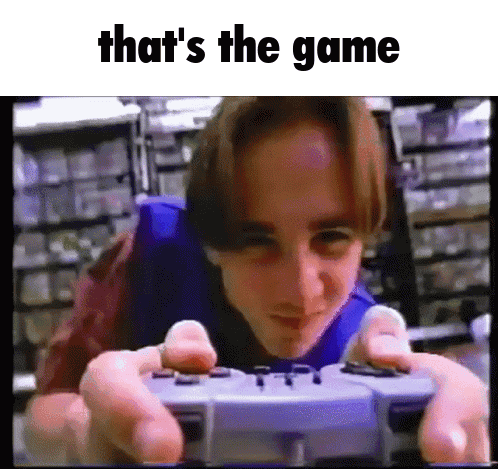 A Young Man Is Playing A Video Game With The Words That 'S The Game Below Him GIF