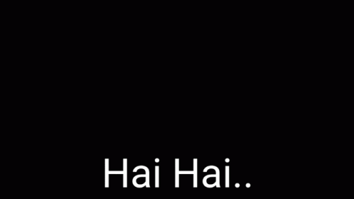 A Young Man Is Singing Into A Microphone With His Eyes Closed And The Words Hai Hai . GIF