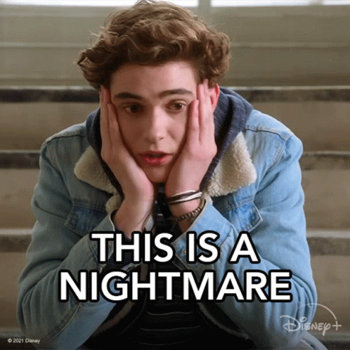 A Young Man Is Sitting On A Set Of Stairs With His Hands On His Face And The Words This Is A Nightmare Above Him GIF